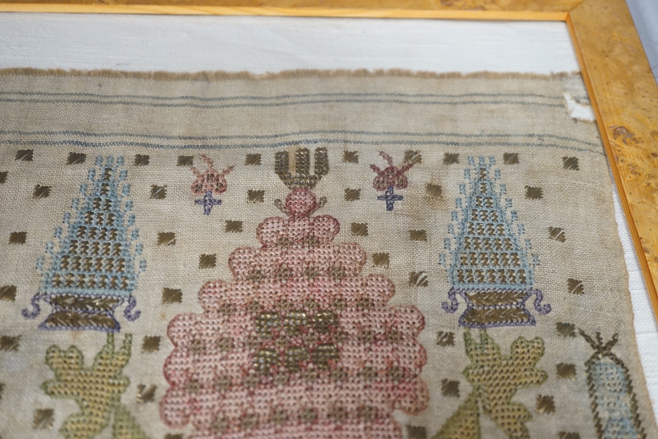 Two 19th century embroidered Turkish towel ends, one framed, 46cms wide x 30cms high